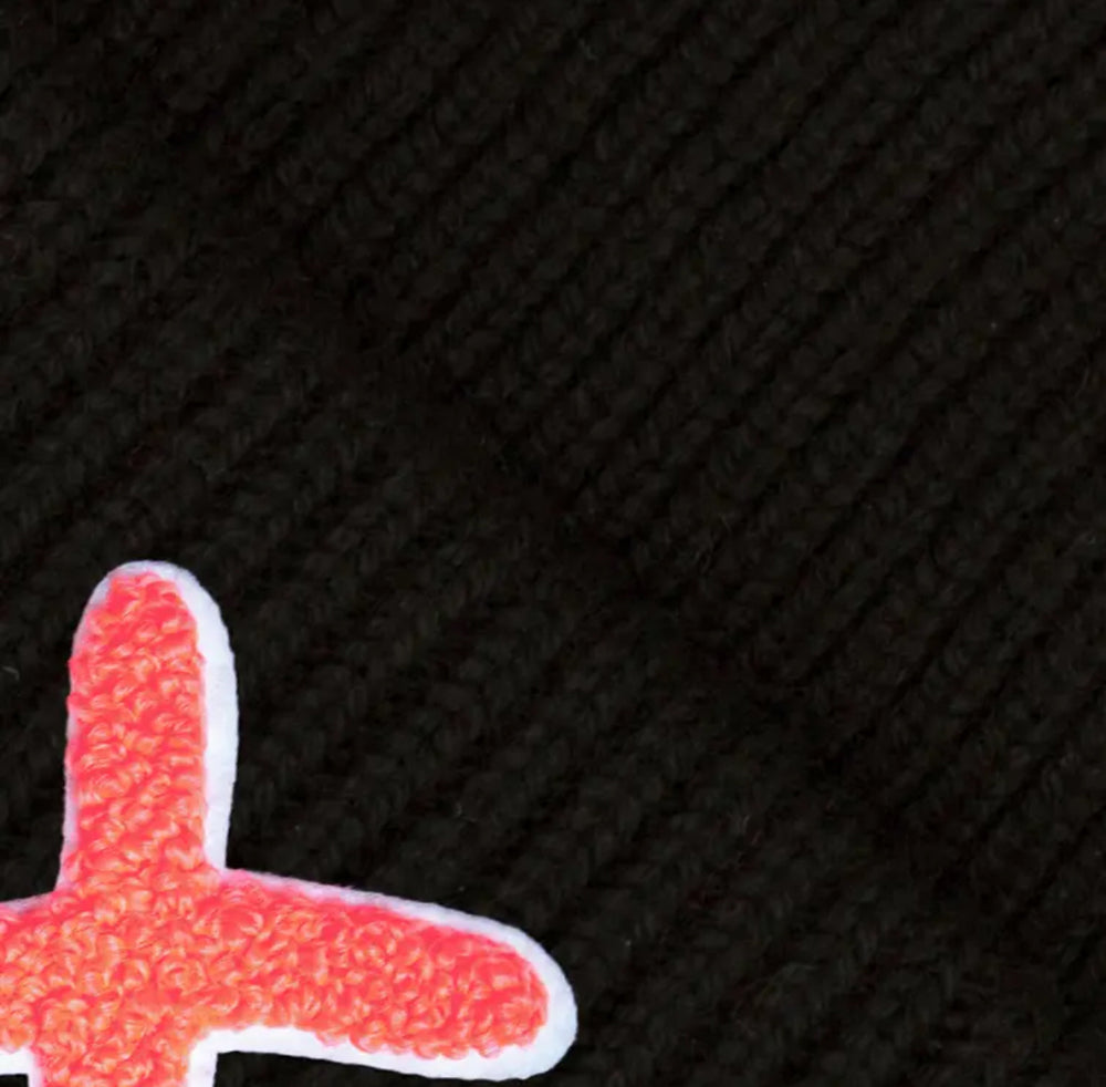 UNIO Strickmütze Lumi X Merinowolle Cashmere Unisex Nachhaltig Fair Produziert X-Patch Orange Schwarz Detail