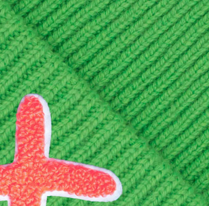 UNIO Mütze Lumi X Merinowolle Cashmere Fresh Green X-Patch Orange Unisex Detail